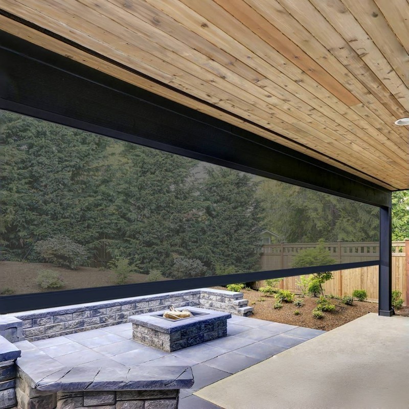A wide retractable patio screen on a covered outdoor living space.
